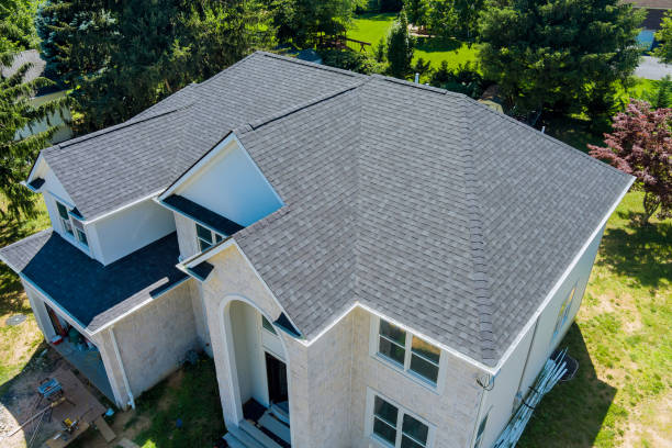Roofing specialists inspecting residential roof in Middletown NJ