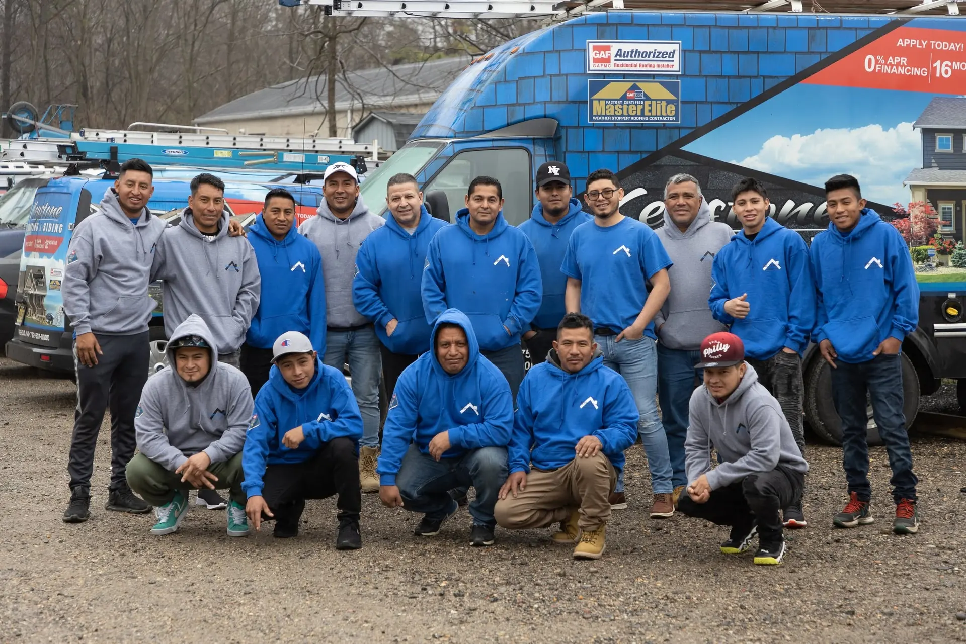 Keystone crew in front of company vans