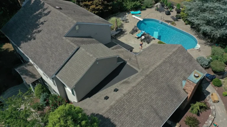 Aerial view of a new roof on a New Jersey home with a backyard pool
