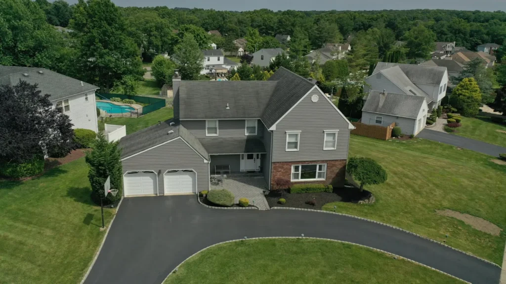 Aerial view of a New Jersey home with a new roof installed by Keystone Roofing