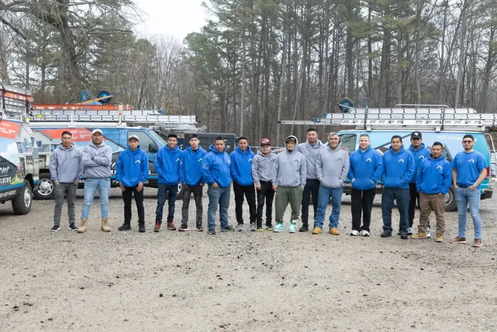 Keystone Roofing crew in front of company trucks in New Jersey